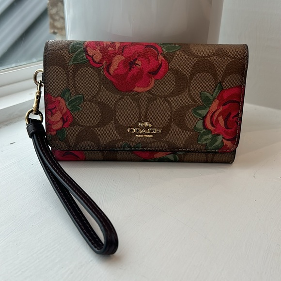 Coach Handbags - Coach flap phone wallet in signature canvas with rose print